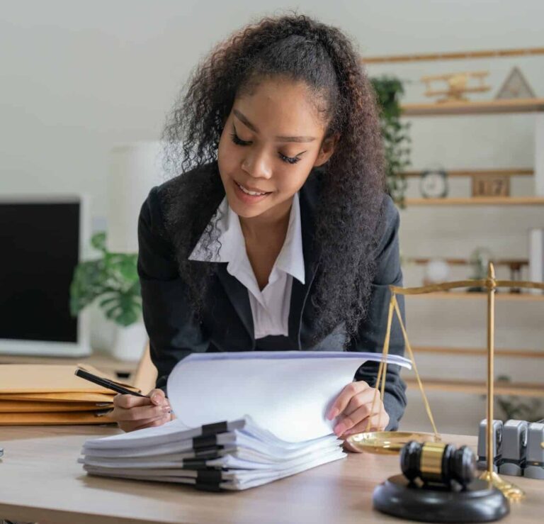 judge gavel justice lawyers business woman in suit or lawyer working on a documents legal law e1666440633507